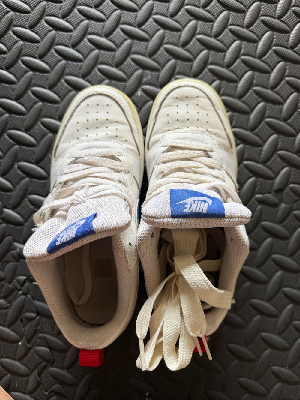 Nike Kids White Sneakers with Blue Logo Accent